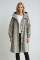 Women's hooded trench coat with buttons, long sleeves and side pockets