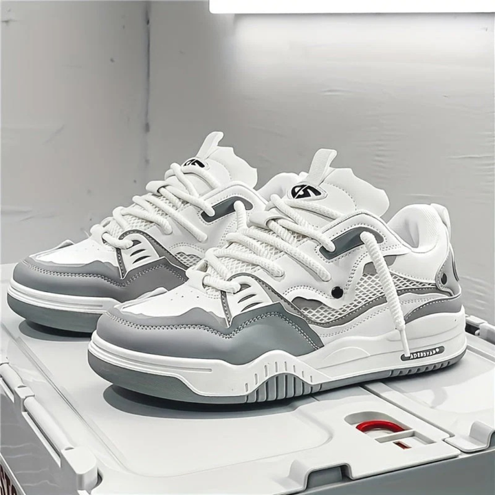 Modern layered lace-up sneakers with contrasting panels and chunky soles