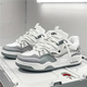 Modern layered lace-up sneakers with contrasting panels and chunky soles