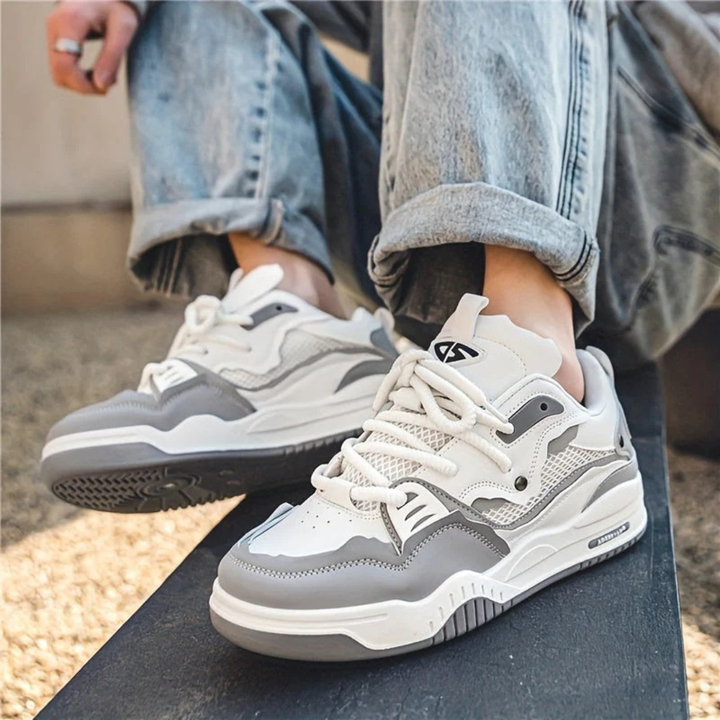 Modern layered lace-up sneakers with contrasting panels and chunky soles