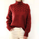 Women's cable knit turtleneck sweater with long sleeves and ribbed trims