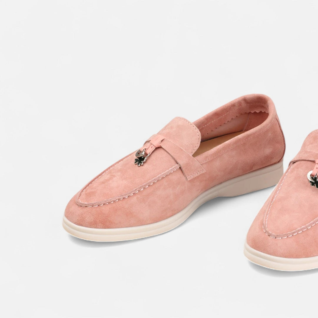 Men's textured slip-on loafers with flat soles, stitched apron detail and decorative toggle trim