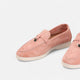 Men's textured slip-on loafers with flat soles, stitched apron detail and decorative toggle trim