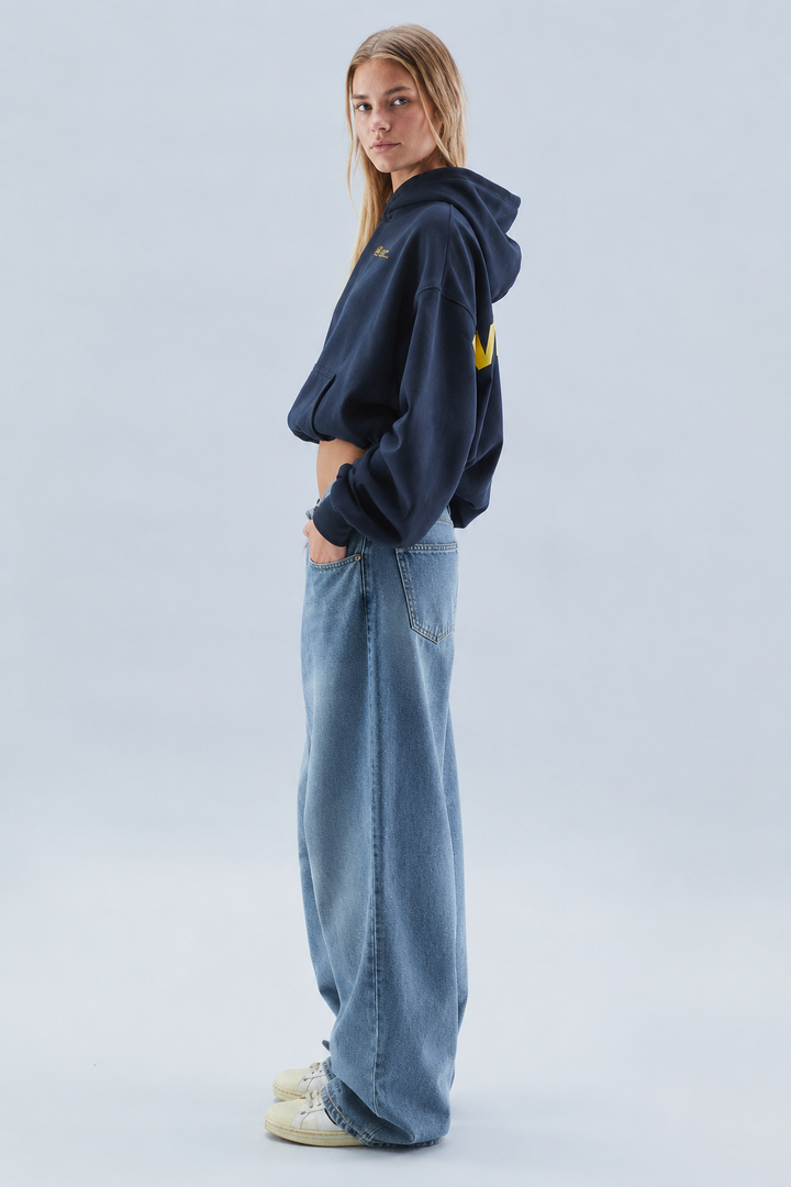 Women's oversized cropped hooded sweatshirt with long sleeves and chest text graphics