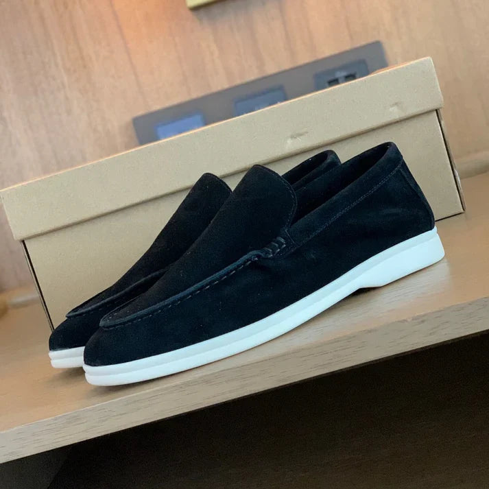 Slip-on loafers with moc-toe stitching and flat contrasting soles