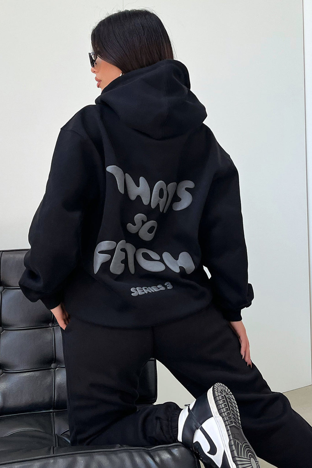 Women's black hoodie with hood and contrasting back graphic