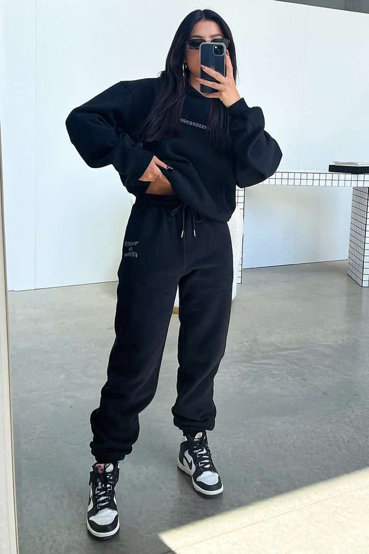 Women's black hoodie with hood and contrasting back graphic