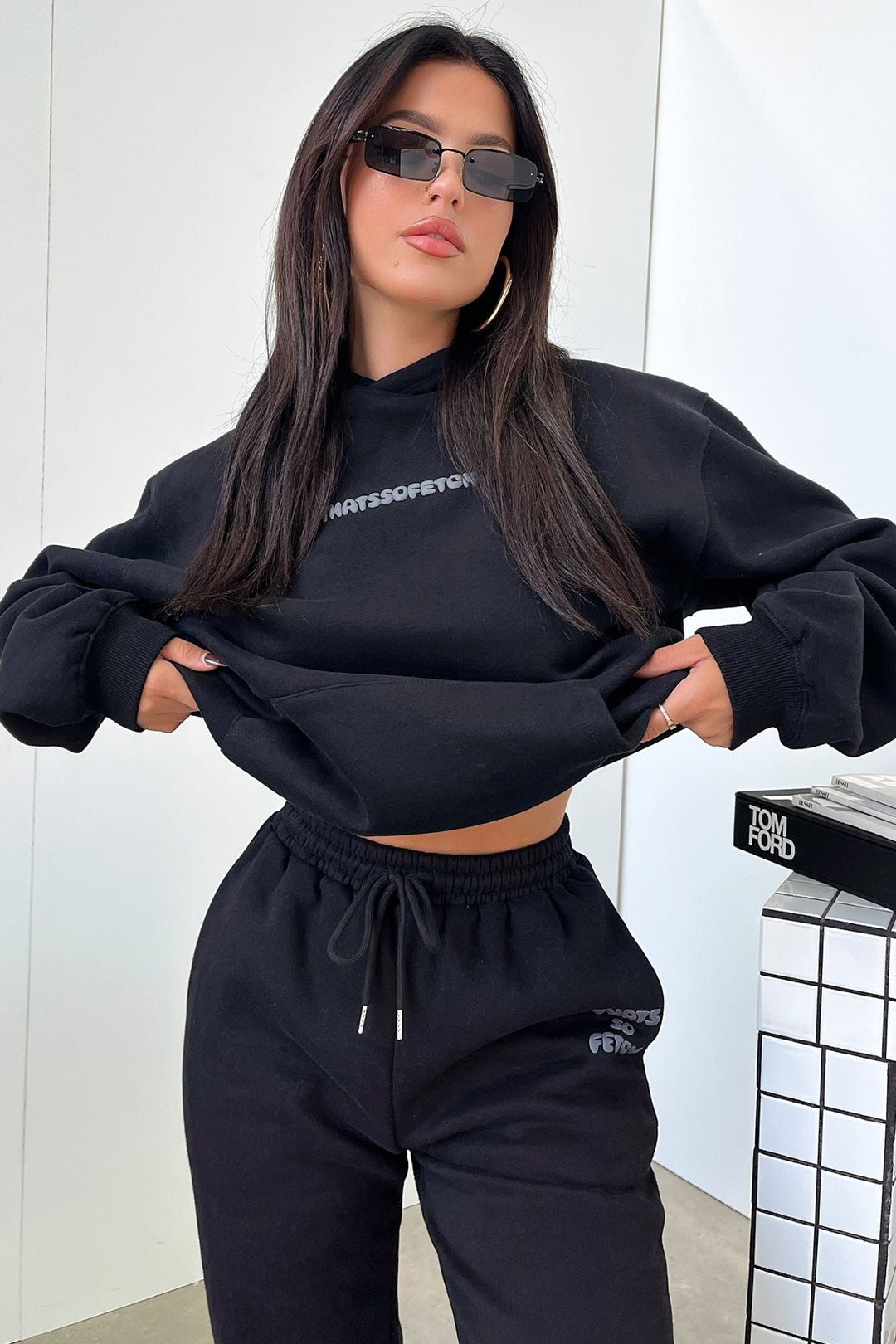 Women's black hoodie with hood and contrasting back graphic