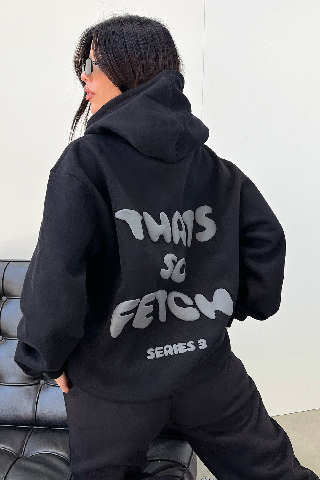 Women's black hoodie with hood and contrasting back graphic