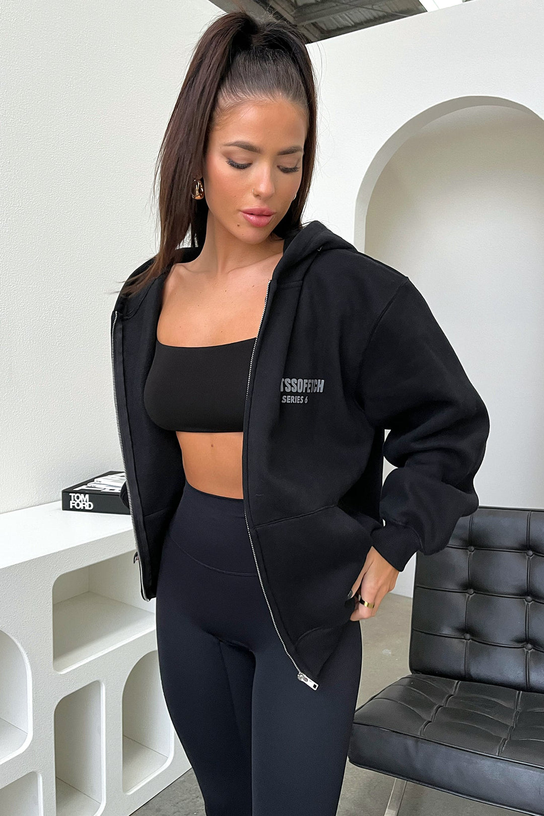 Women's black cropped zip-up hoodie with hood and front pockets