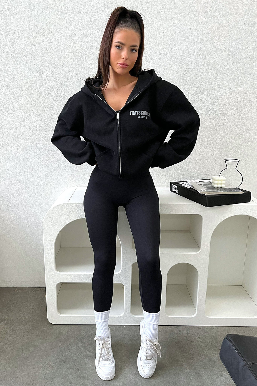 Women's black cropped zip-up hoodie with hood and front pockets