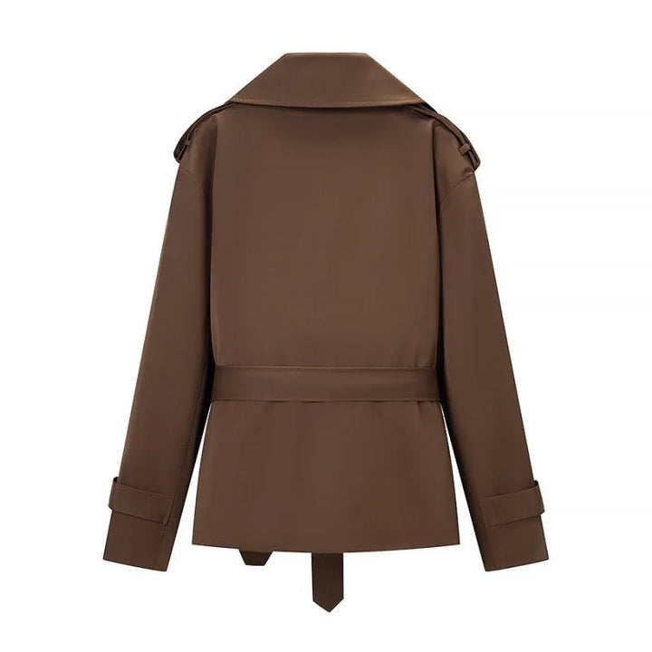 Women's brown cropped trench coat with wide lapels and belt