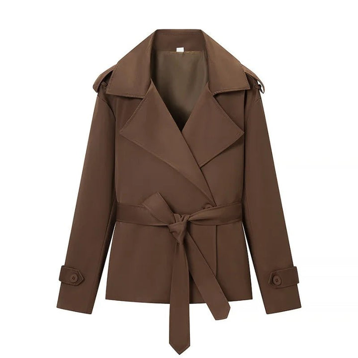 Women's brown cropped trench coat with wide lapels and belt