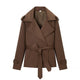 Women's brown cropped trench coat with wide lapels and belt