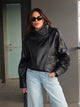 Women's asymmetrical jacket with high collar and long sleeves