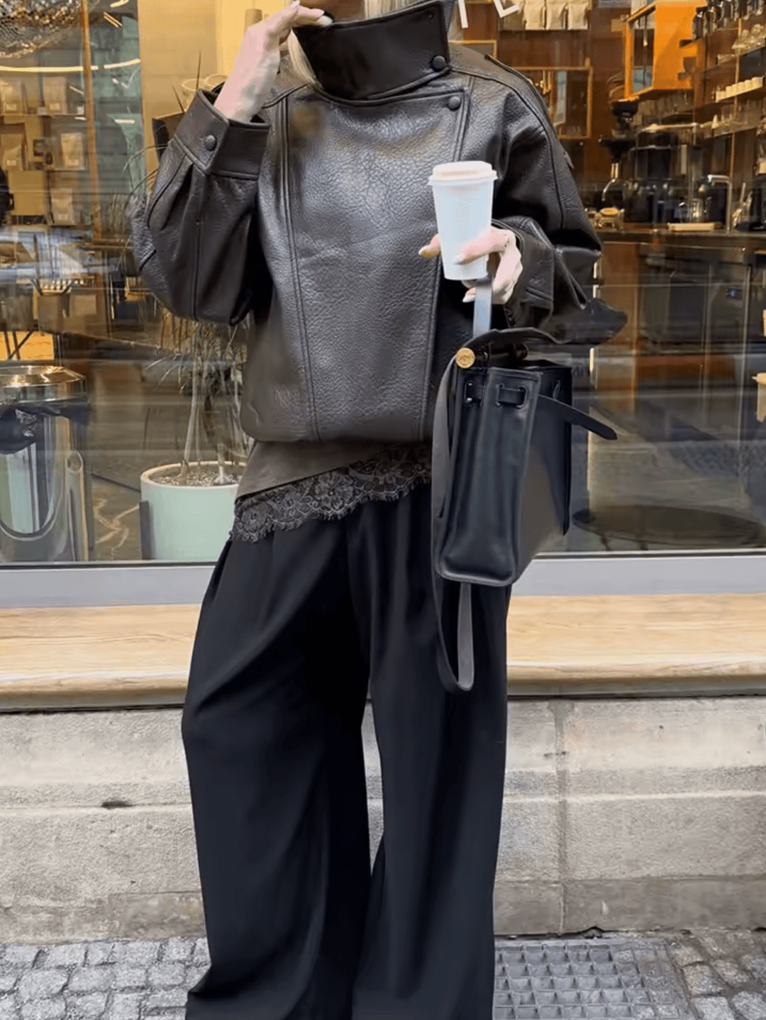 Women's asymmetrical jacket with high collar and long sleeves