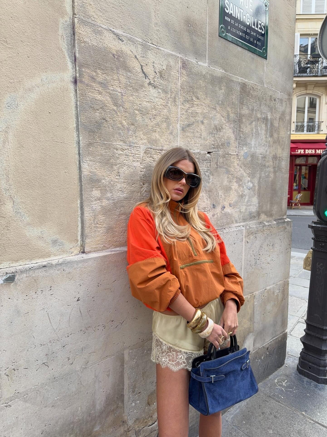 Women's orange and red colorblock half-zip windbreaker jacket