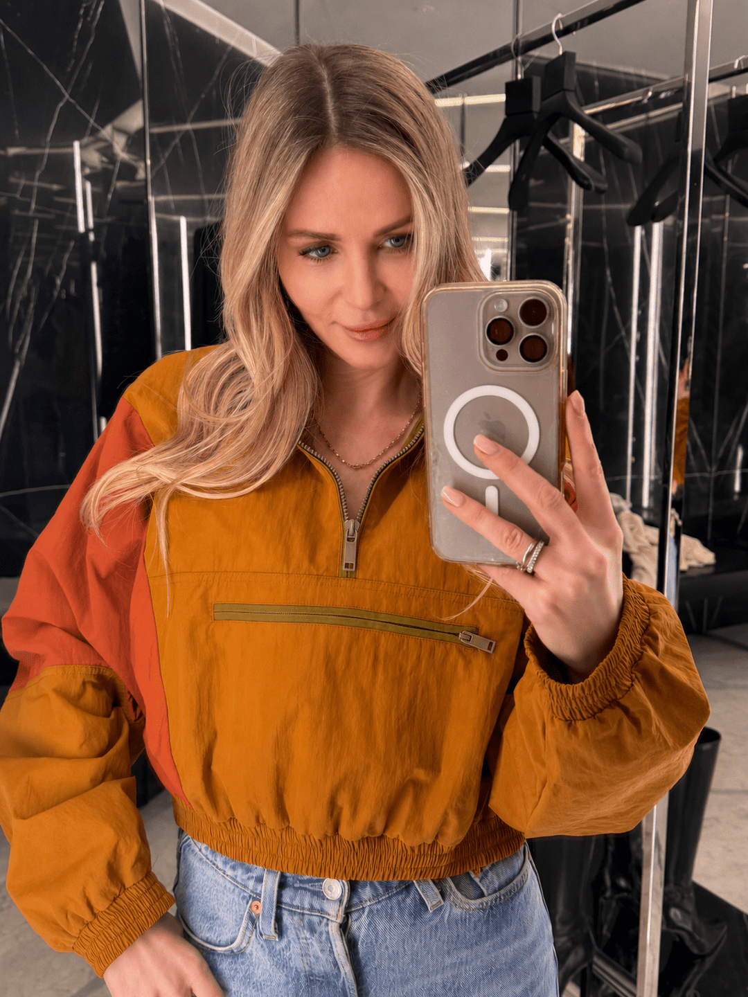 Women's orange and red colorblock half-zip windbreaker jacket