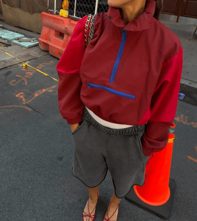 Women's orange and red colorblock half-zip windbreaker jacket