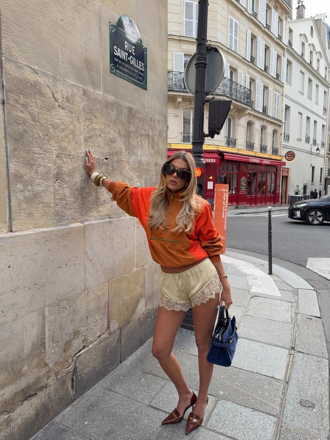 Women's orange and red colorblock half-zip windbreaker jacket