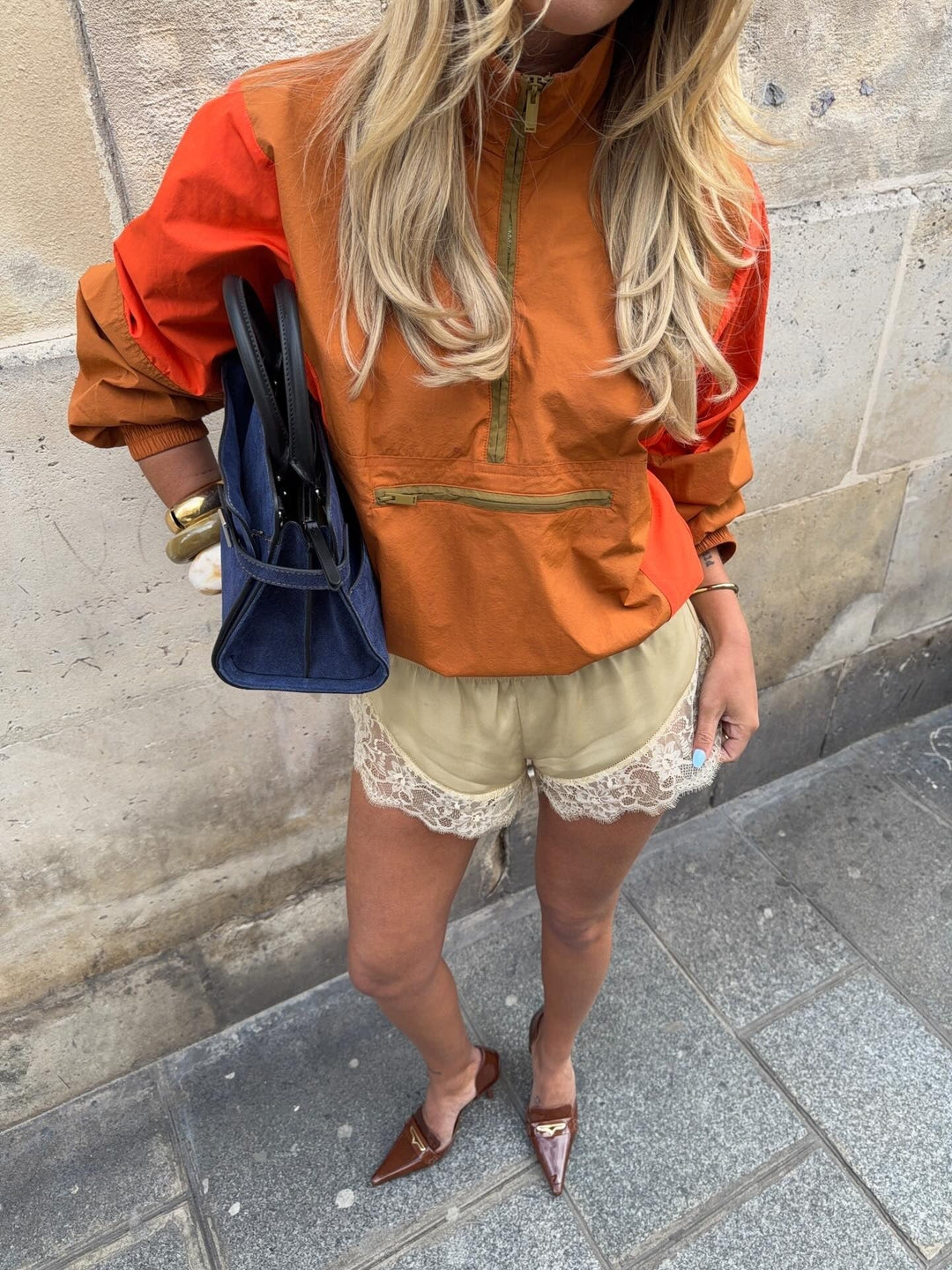 Women's orange and red colorblock half-zip windbreaker jacket
