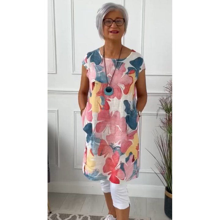 Women's floral print shift dress with short sleeves, crew neck and mid-calf hem