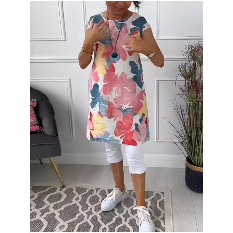 Women's floral print shift dress with short sleeves, crew neck and mid-calf hem