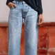 Women's cropped straight-leg jeans with high waist and distressed details