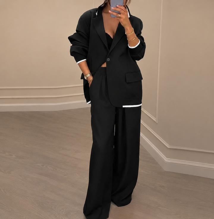 Women's blazer and wide-leg trousers suit set with notched lapels and button fastening