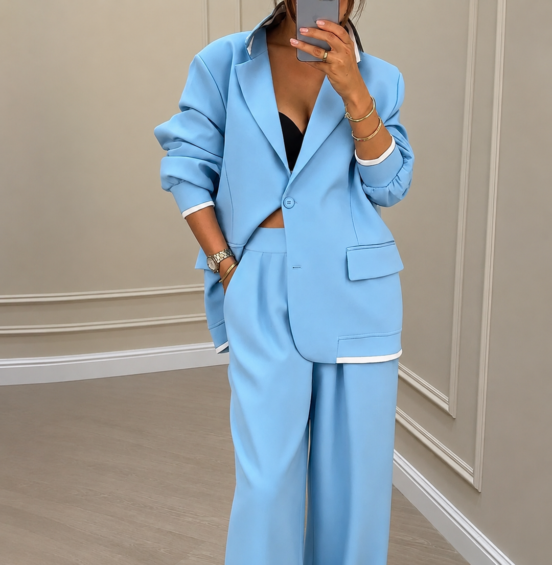 Women's blazer and wide-leg trousers suit set with notched lapels and button fastening