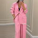 Women's blazer and wide-leg trousers suit set with notched lapels and button fastening