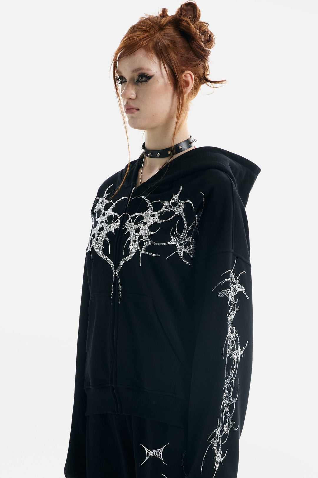 Black hooded zip hoodie with silver rhinestone thorn and wing graphics