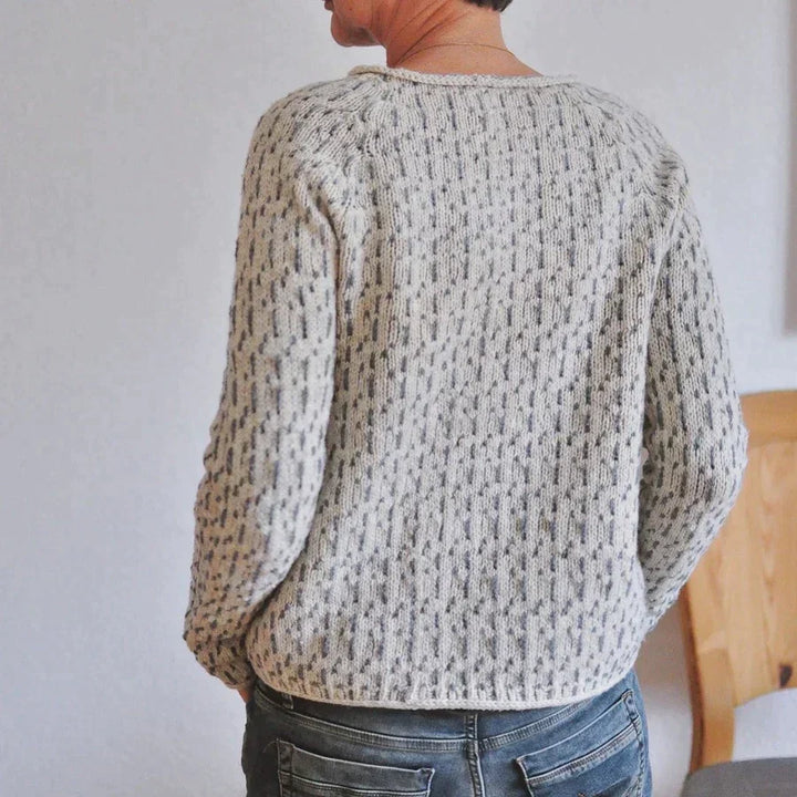 Women's gray textured knit sweater with crew neckline and long sleeves
