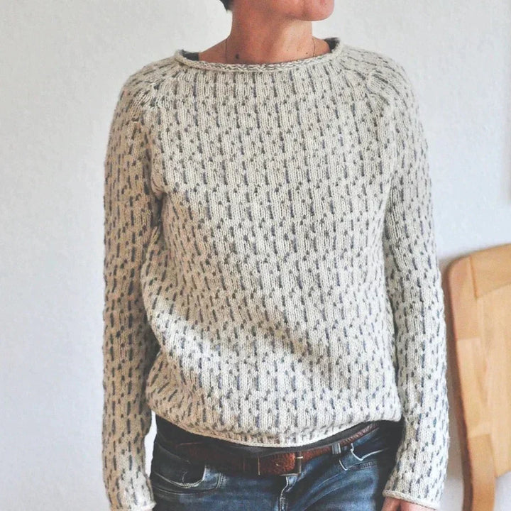 Women's gray textured knit sweater with crew neckline and long sleeves
