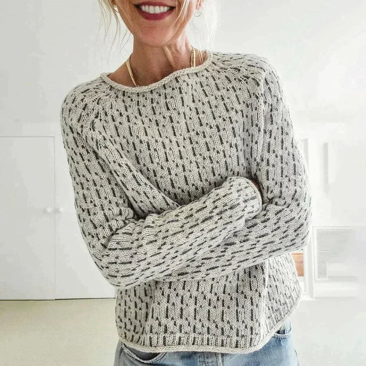 Women's gray textured knit sweater with crew neckline and long sleeves