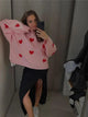 Women's patterned knit sweater with crew neck, long sleeves and contrasting motifs