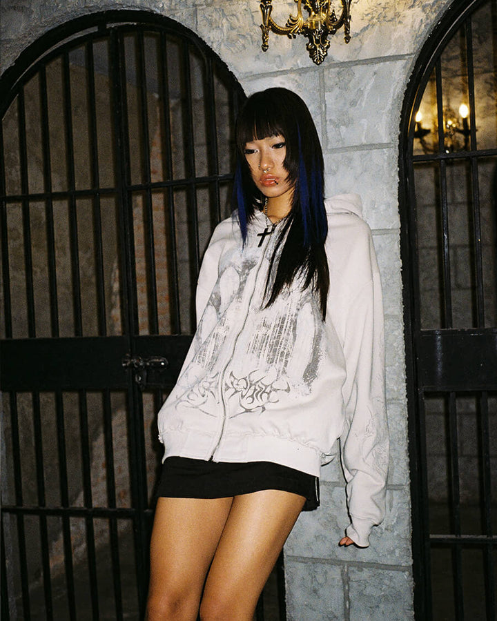 Light coloured zip up hoodie with cathedral graphic print and hood