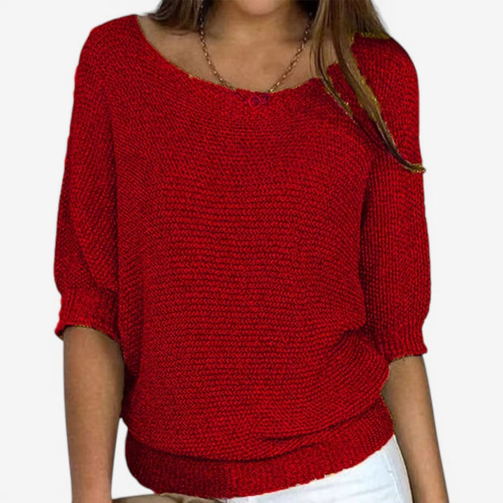 Women's textured knit sweater with round neckline and three-quarter sleeves