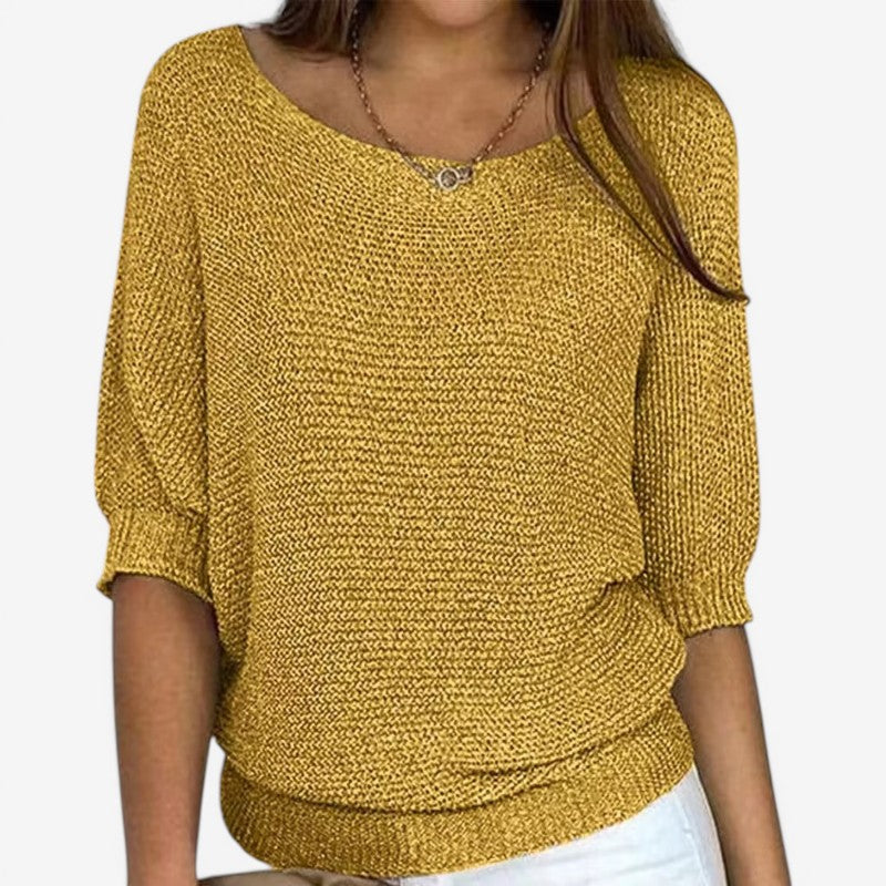 Women's textured knit sweater with round neckline and three-quarter sleeves
