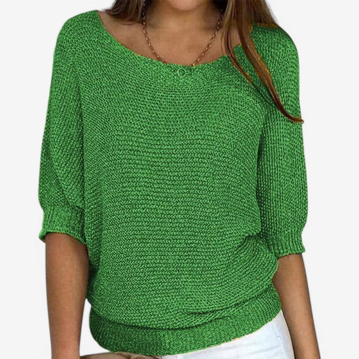 Women's textured knit sweater with round neckline and three-quarter sleeves