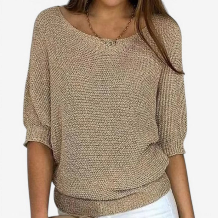 Women's textured knit sweater with round neckline and three-quarter sleeves