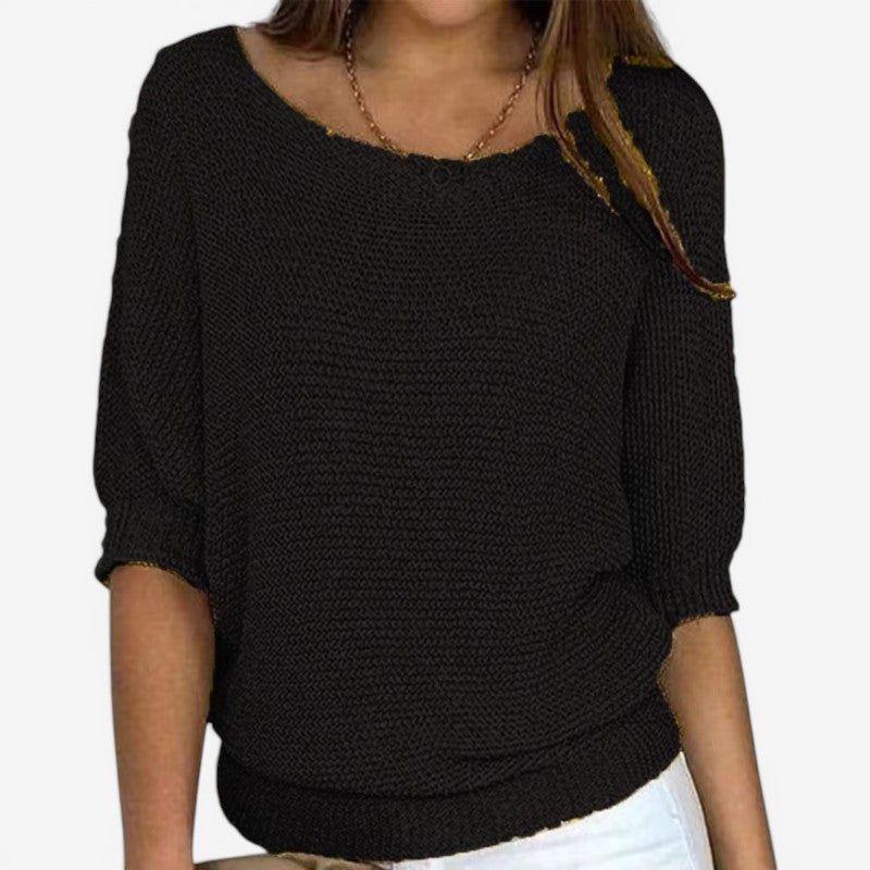 Women's textured knit sweater with round neckline and three-quarter sleeves