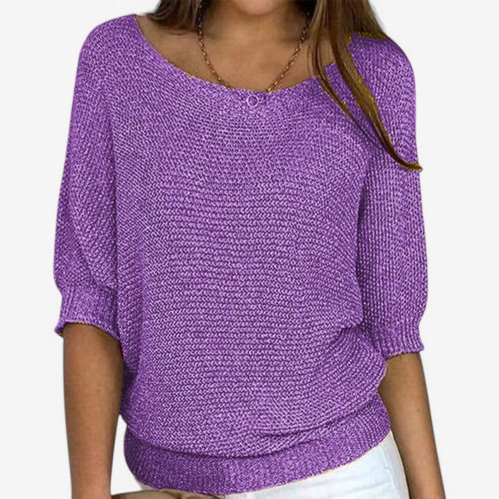 Women's textured knit sweater with round neckline and three-quarter sleeves