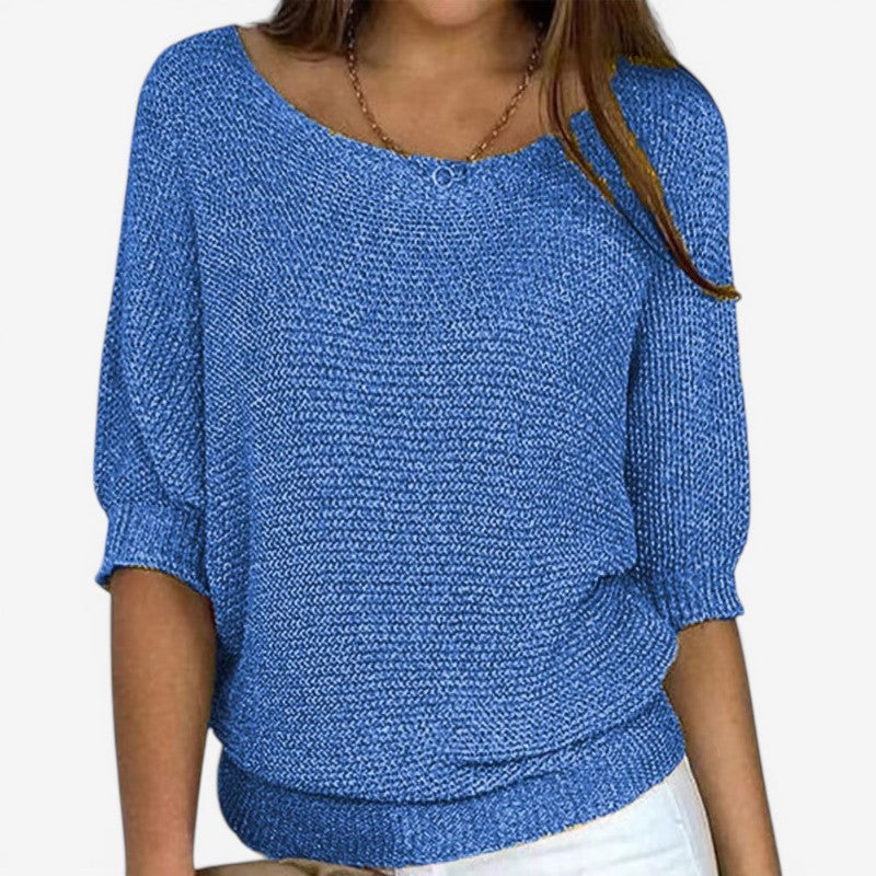 Women's textured knit sweater with round neckline and three-quarter sleeves