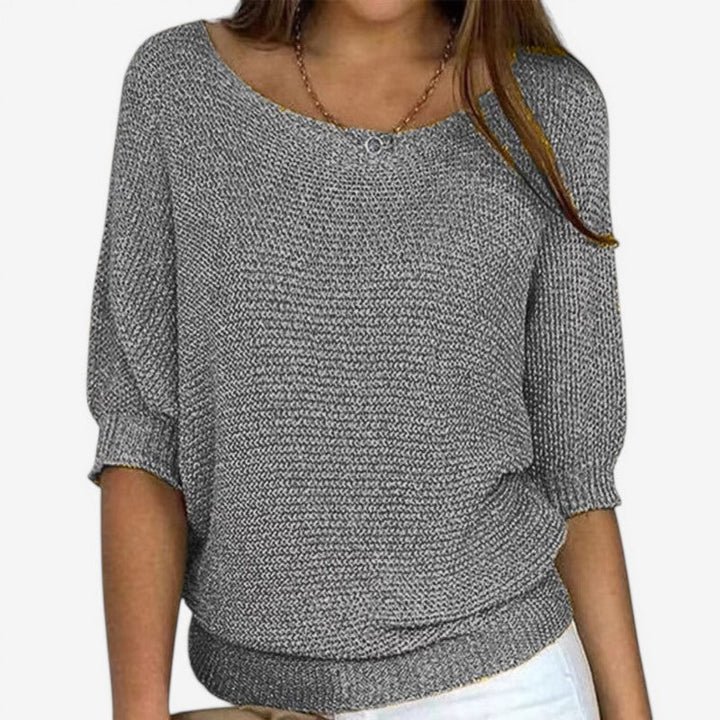 Women's textured knit sweater with round neckline and three-quarter sleeves