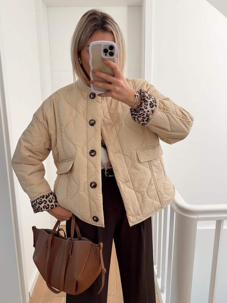 Women's quilted jacket with button front and animal-print cuffs
