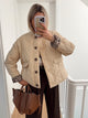 Women's quilted jacket with button front and animal-print cuffs