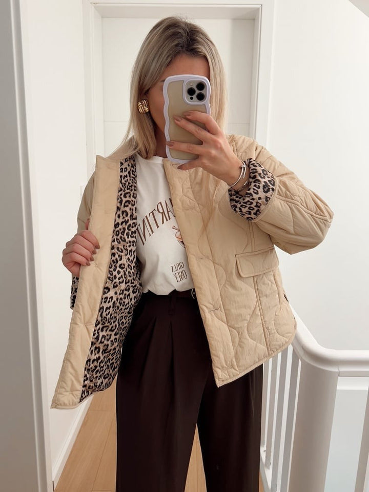 Women's quilted jacket with button front and animal-print cuffs