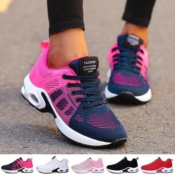 Women's red and white lace-up running trainers with cushioned soles