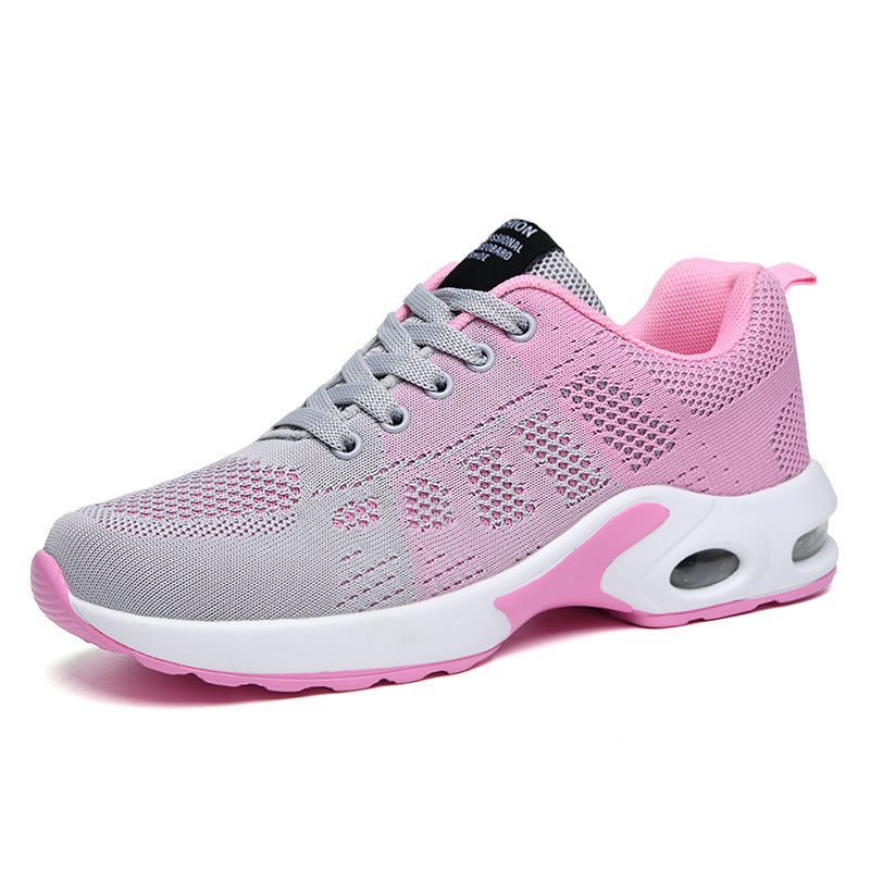 Women's red and white lace-up running trainers with cushioned soles